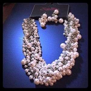 Paparazzi’s Signature pearl necklace and earrings.